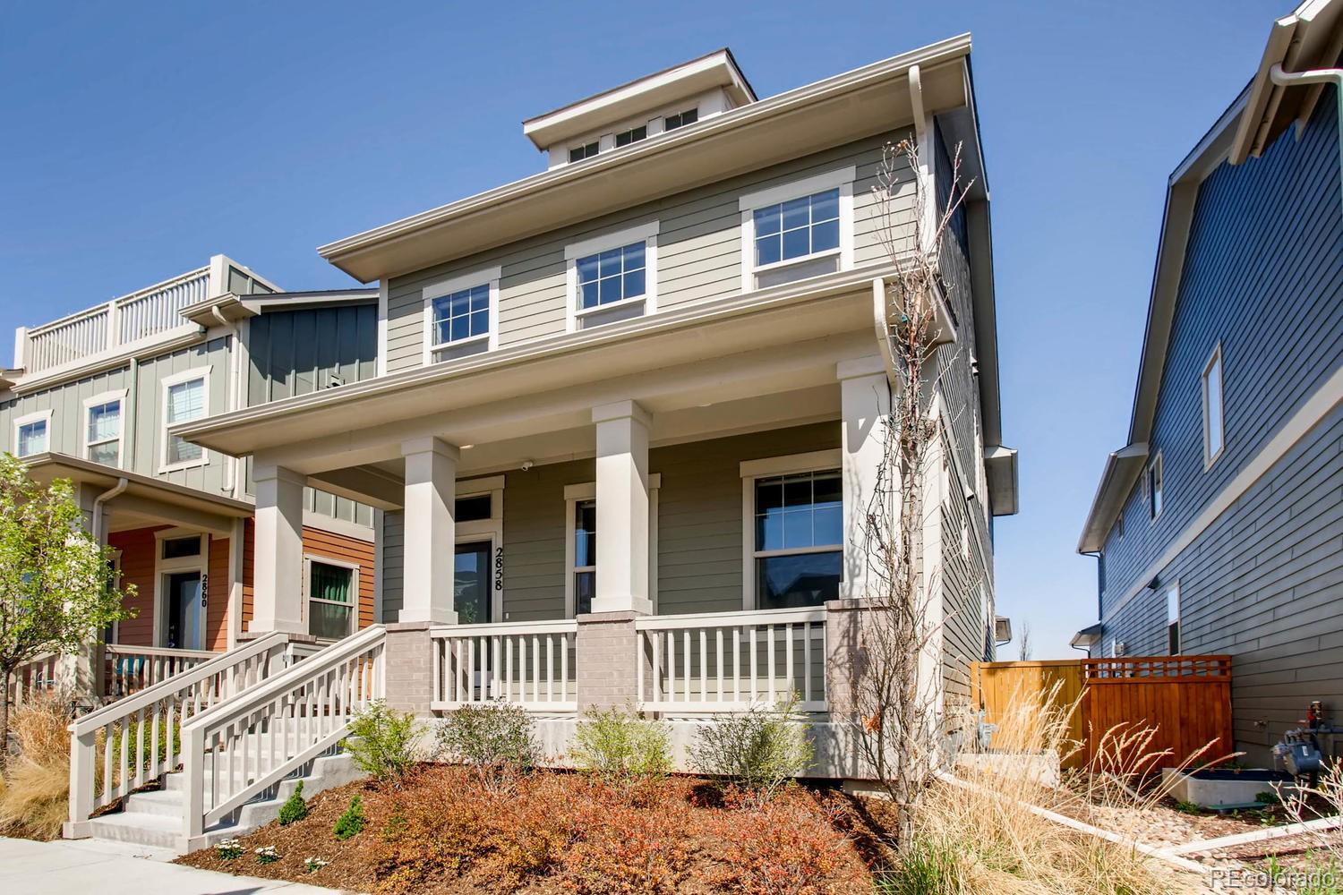 2858 Lima Street Denver, CO 80238 - Photo 2 of 28 a front view of a house with a porch