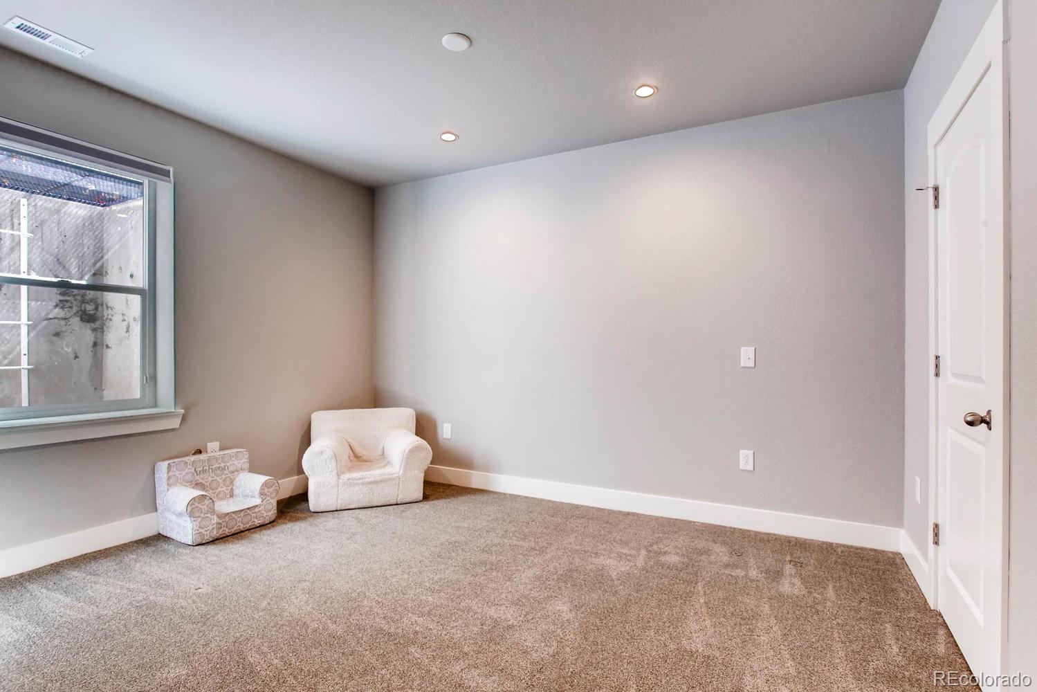 2858 Lima Street Denver, CO 80238 - Photo 23 of 28 a room with a bed and a window