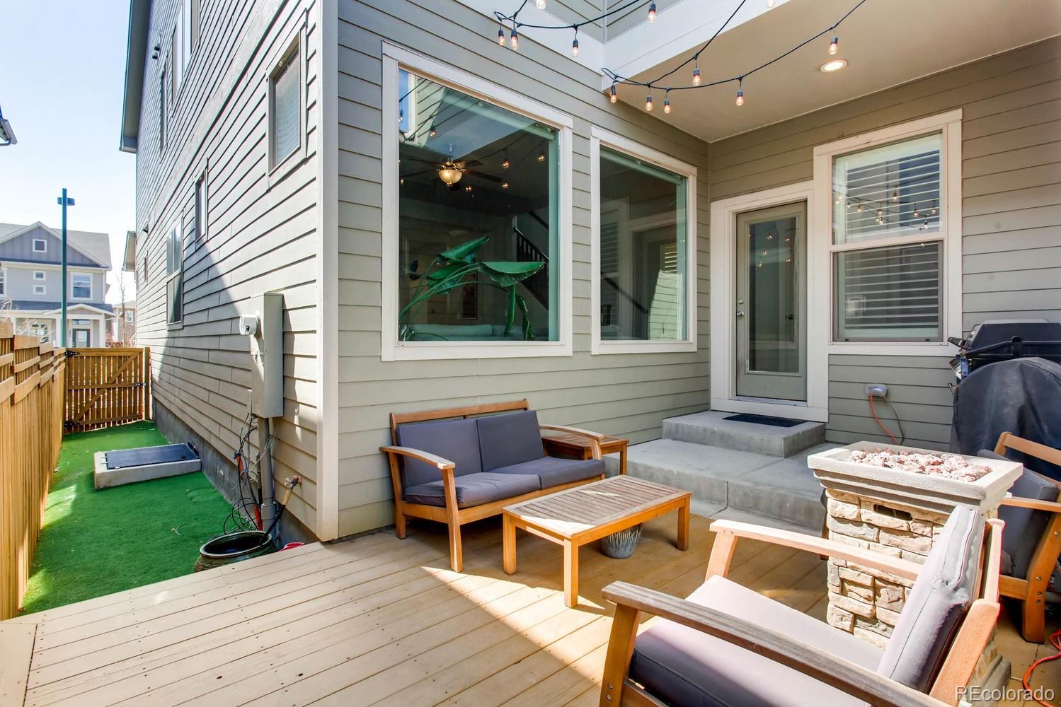 2858 Lima Street Denver, CO 80238 - Photo 26 of 28 a backyard of a house with outdoor seating