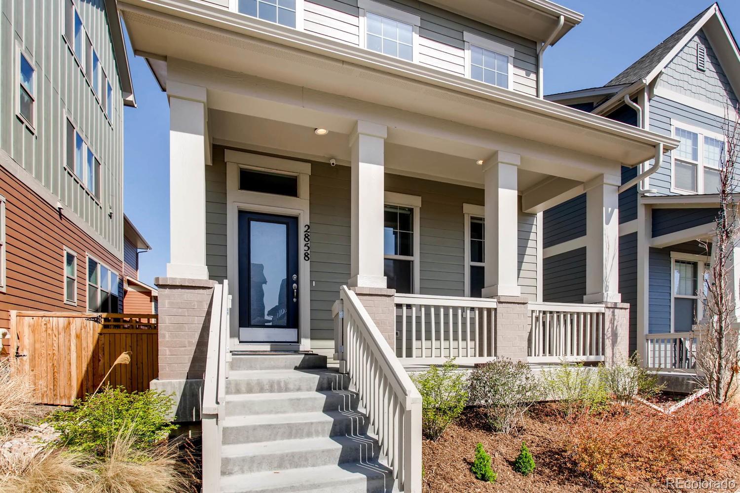 2858 Lima Street Denver, CO 80238 - Photo 3 of 28 front view of a house with a porch