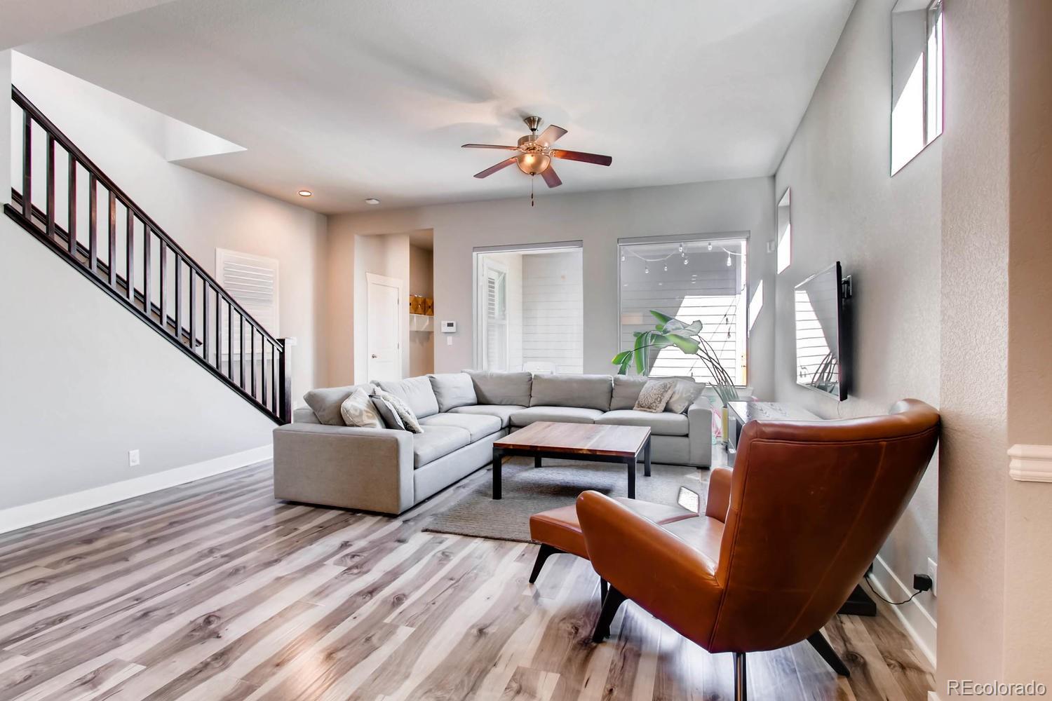 2858 Lima Street Denver, CO 80238 - Photo 6 of 28 a living room with furniture and a large window
