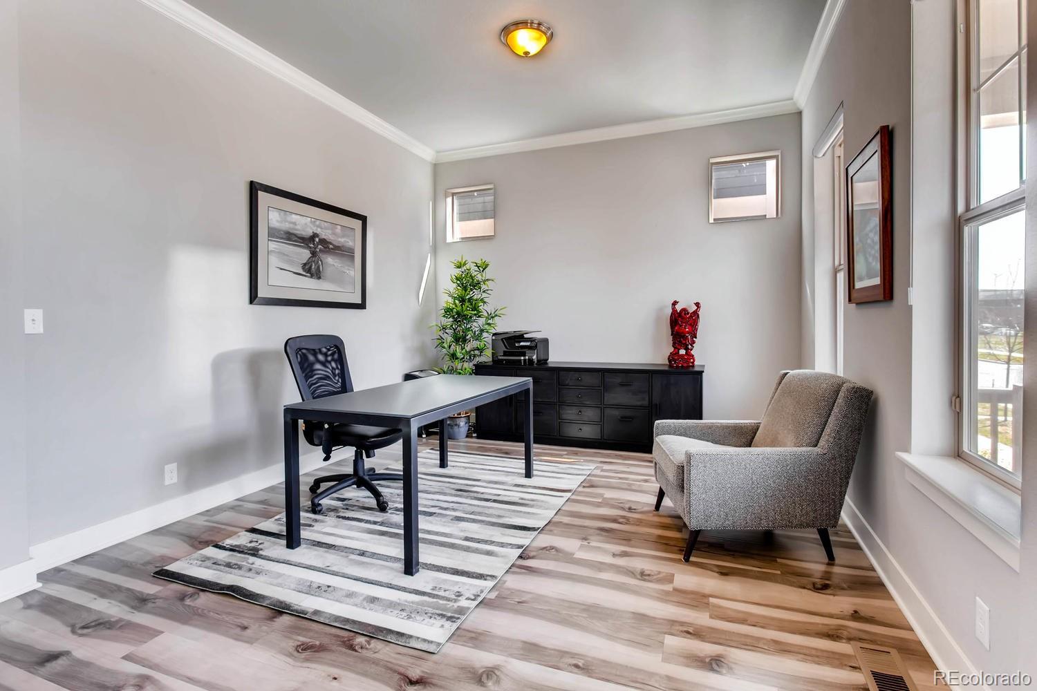 2858 Lima Street Denver, CO 80238 - Photo 8 of 28 a living room with furniture and a window