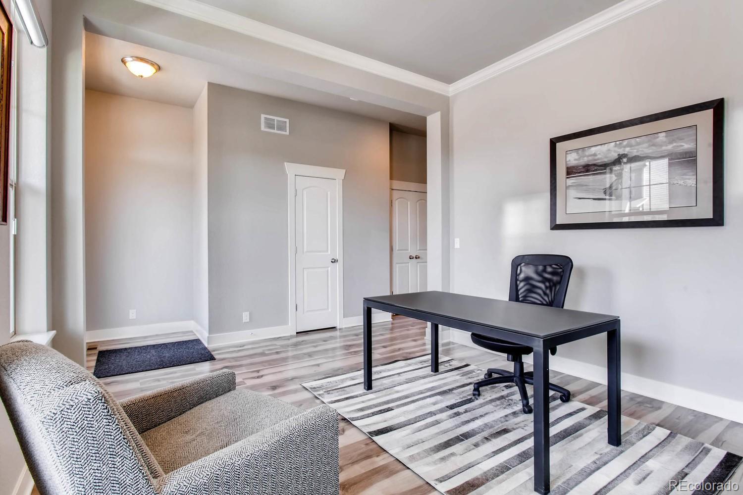 2858 Lima Street Denver, CO 80238 - Photo 9 of 28 a living room with furniture