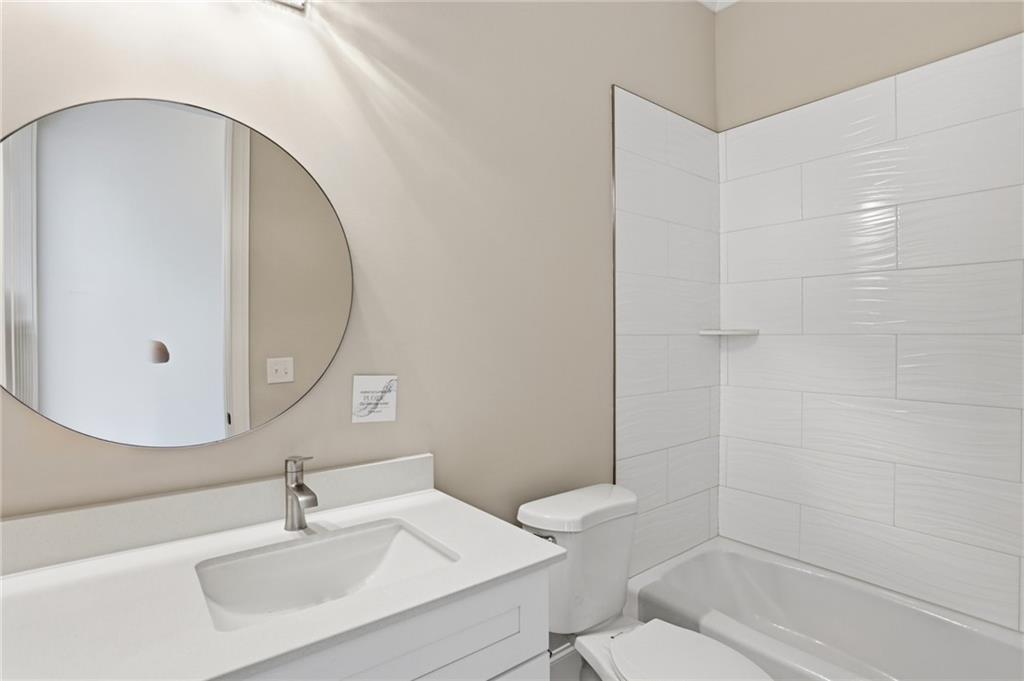 222 Trecastle Square, Unit 21 Canton, GA 30114 - Photo 20 of 33 a bathroom with a sink a toilet and shower