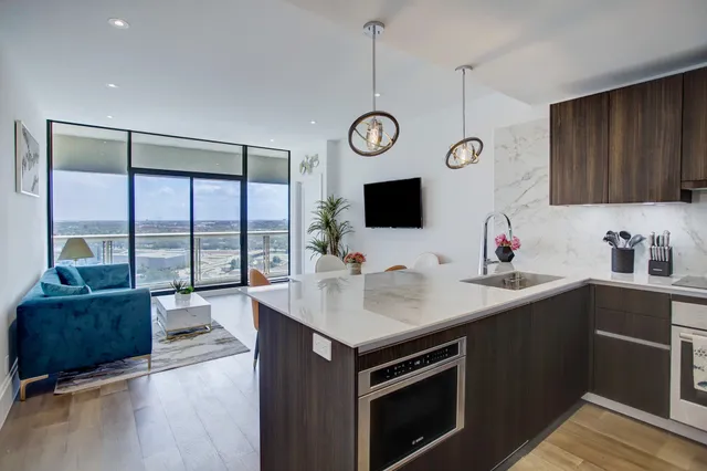 a kitchen with a sink cabinets and window