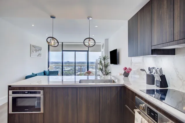a kitchen with a sink and cabinets