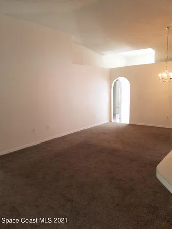 a view of an empty room and window
