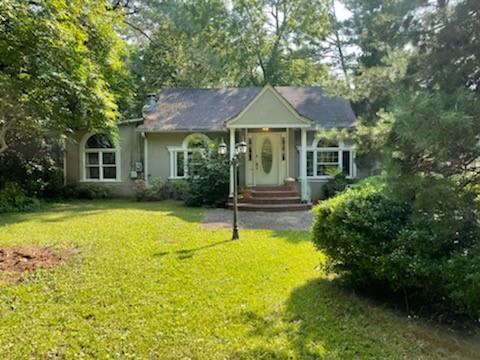 46 Johnson Ferry Road Sandy Springs, GA 30328 - Photo 1 of 1 a front view of a house with a yard