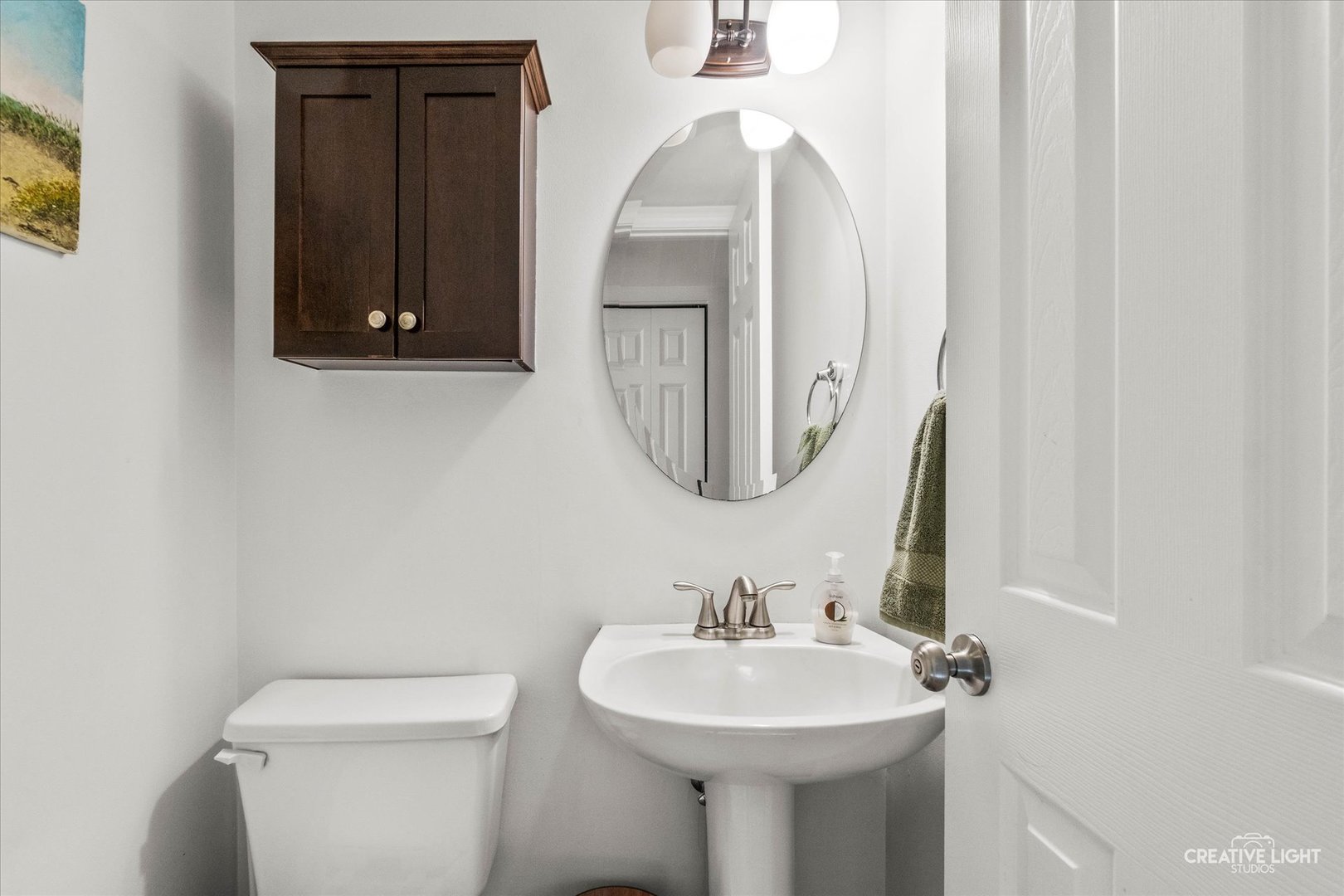 170 Half Moon Circle Aurora, IL 60504 - Photo 8 of 15 a bathroom with a toilet sink and mirror