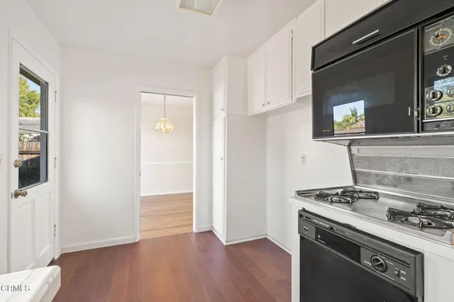 a kitchen with a stove and a microwave