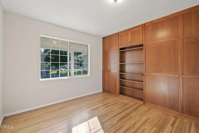a view of an empty room and wooden floor