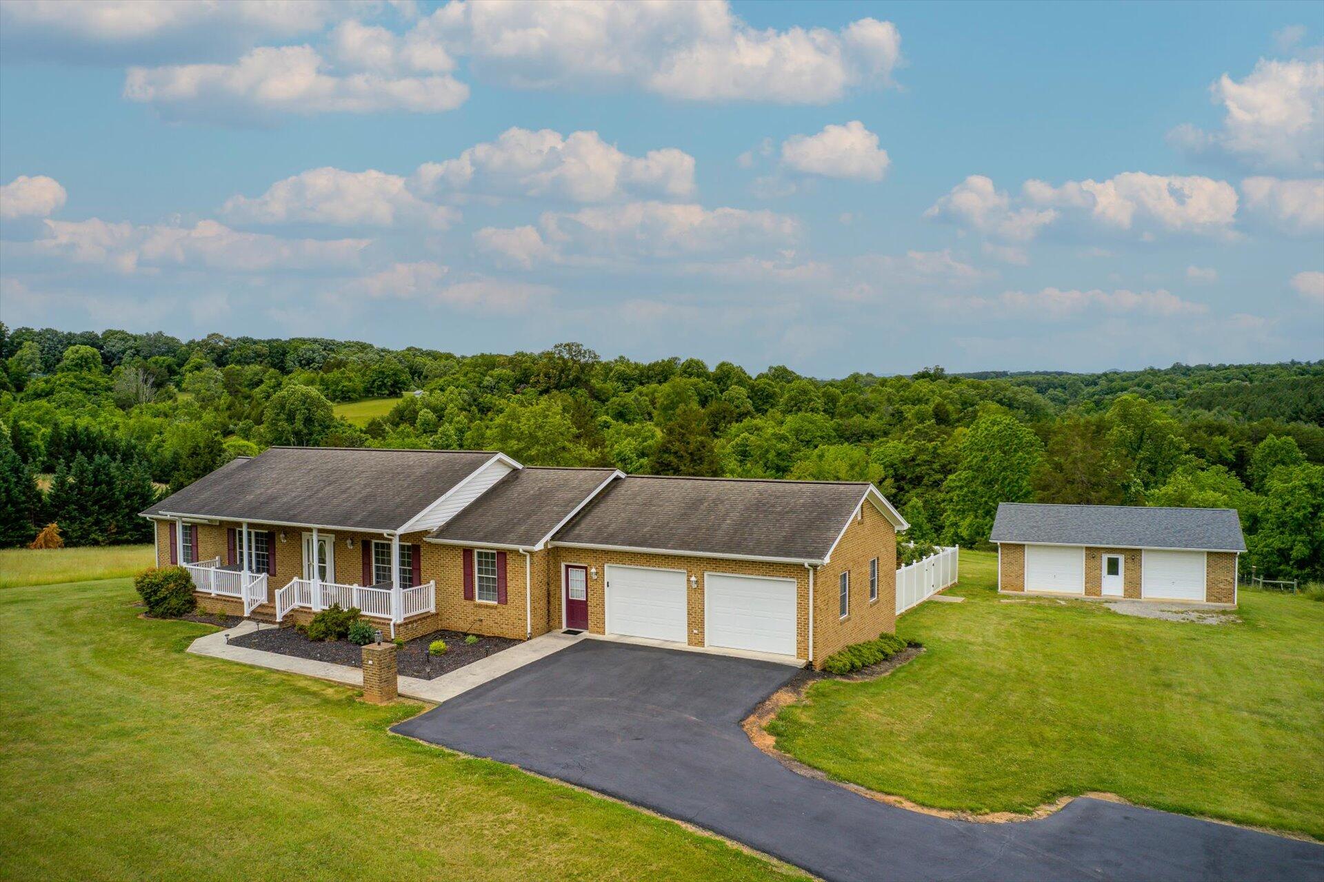705 Middle Valley Road Hardy, VA 24101 - Photo 1 of 55 an aerial view of a house with swimming pool and garden