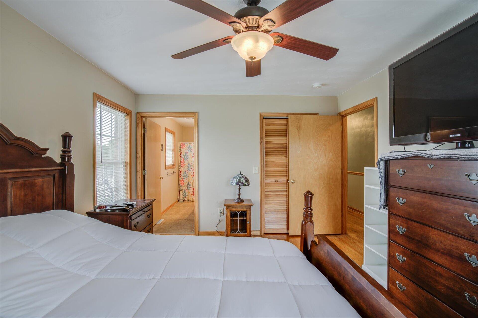 705 Middle Valley Road Hardy, VA 24101 - Photo 19 of 55 a bedroom with a bed and a flat screen tv