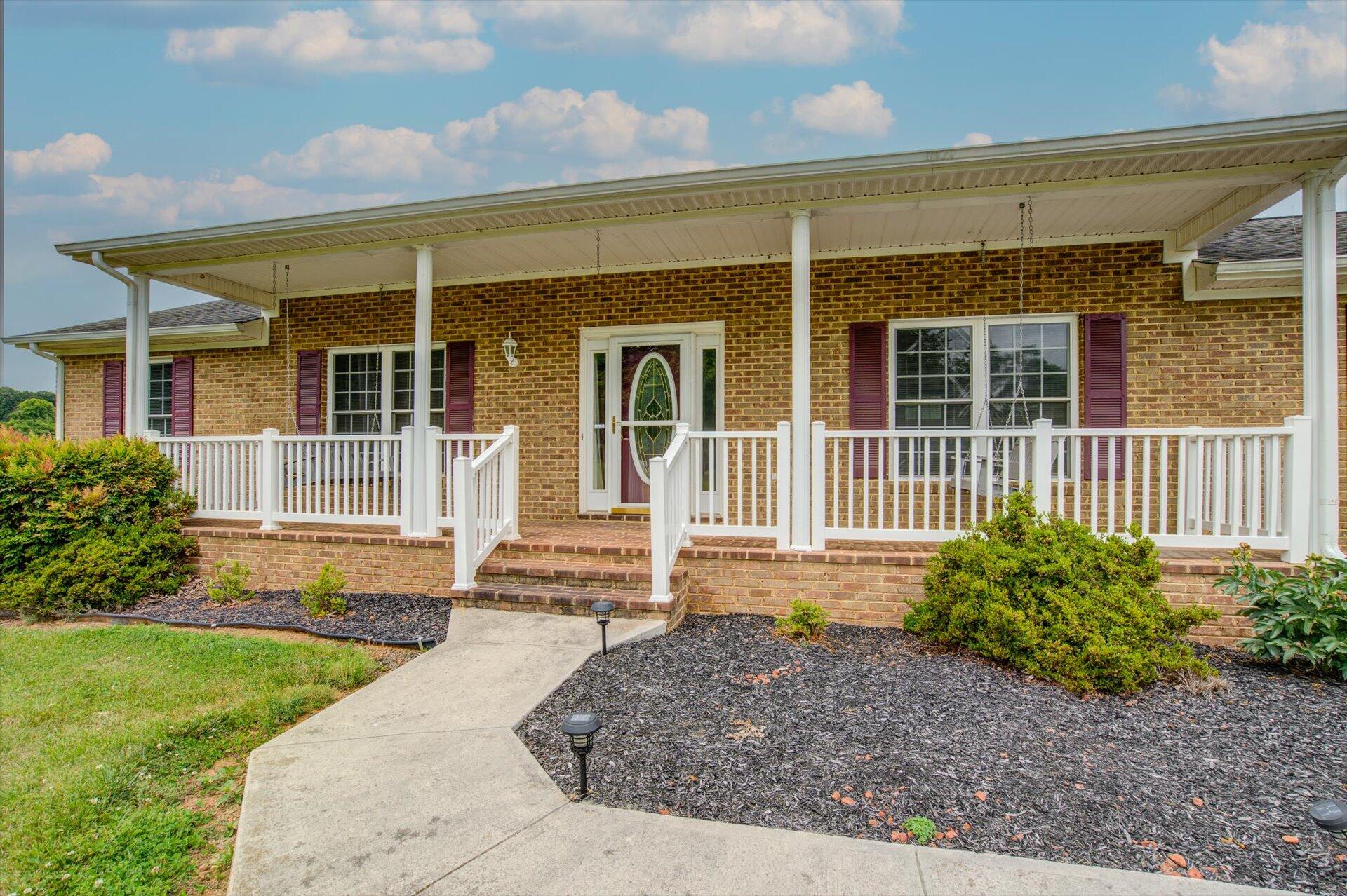 705 Middle Valley Road Hardy, VA 24101 - Photo 4 of 55 front view of a house with a yard