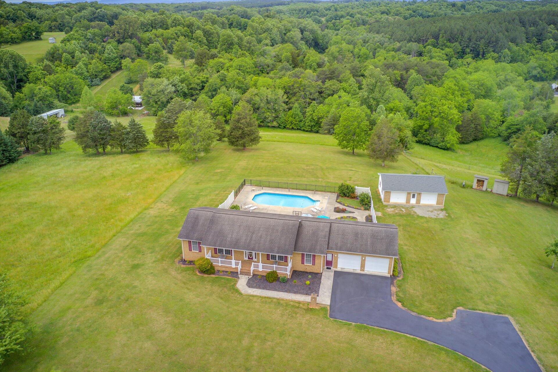705 Middle Valley Road Hardy, VA 24101 - Photo 50 of 55 a swimming pool with some trees in the background