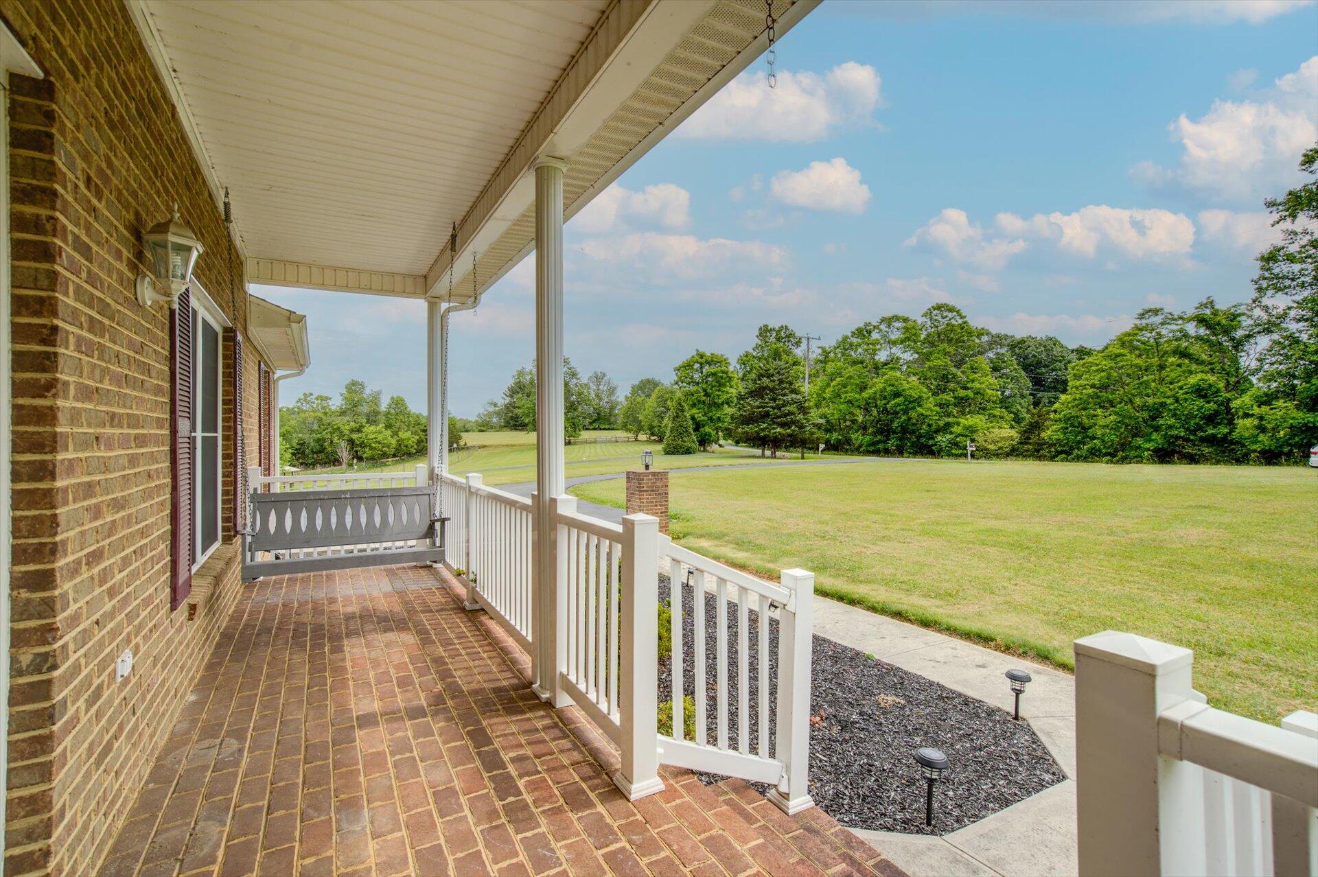 705 Middle Valley Road Hardy, VA 24101 - Photo 5 of 55 a view of a balcony with wooden floor and fence