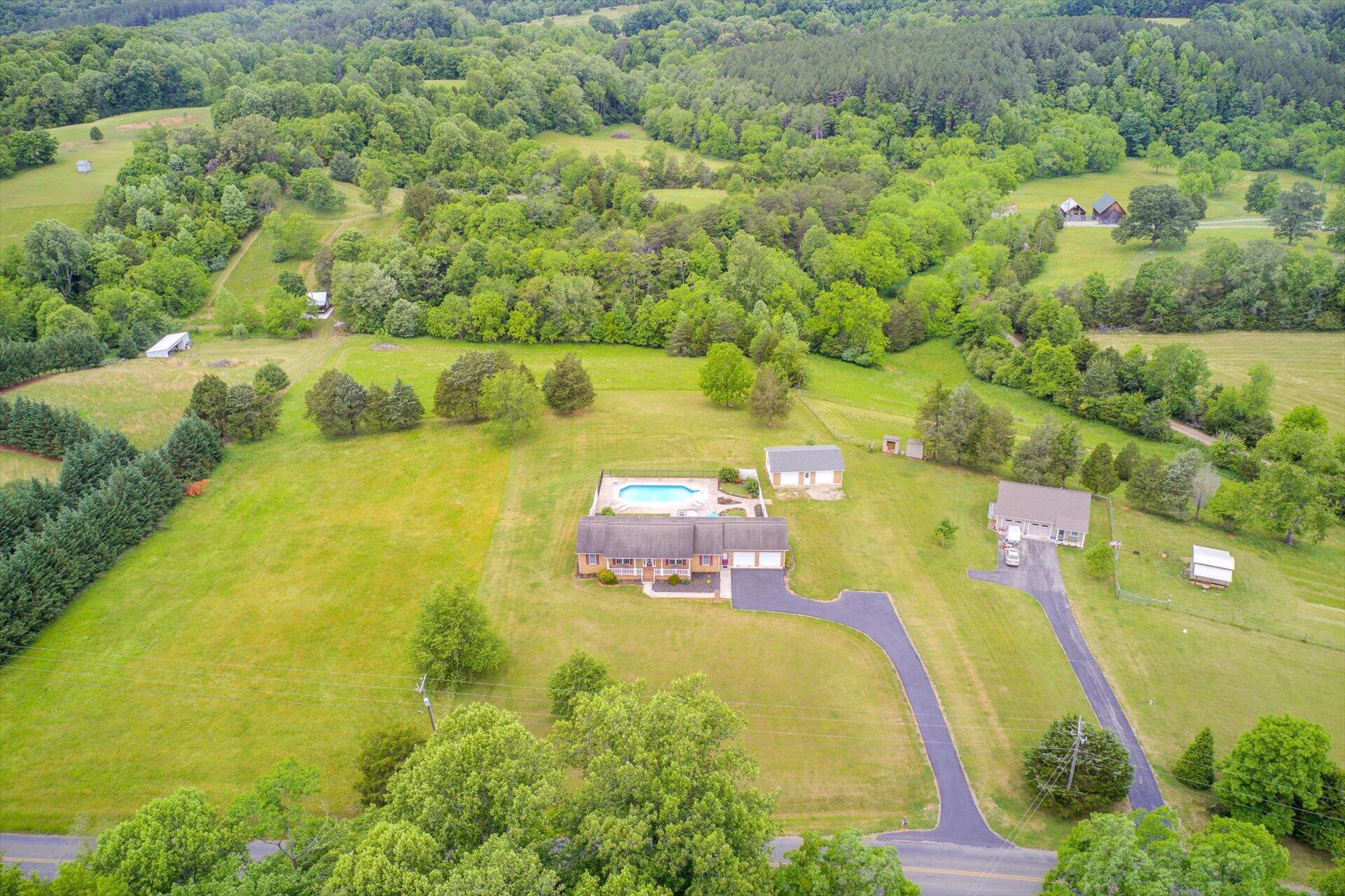 705 Middle Valley Road Hardy, VA 24101 - Photo 52 of 55 a aerial view of a house with a swimming pool