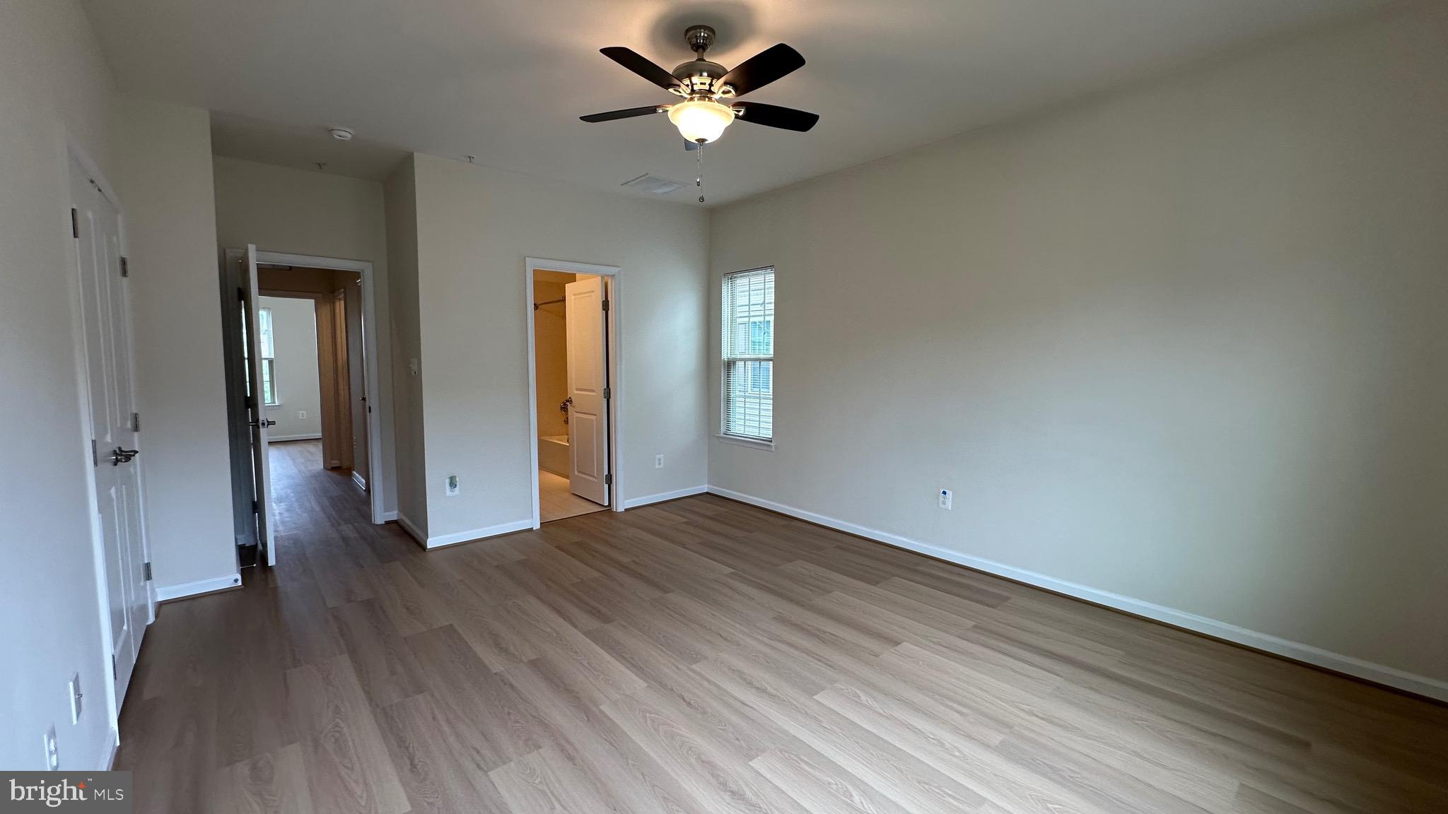 7343 Old Calvary Road Hanover, MD 21076 - Photo 24 of 35 wooden floor in an empty room with a window
