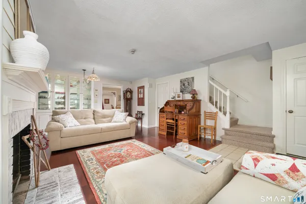 a living room with furniture and a rug