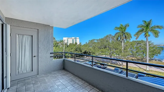 a white toilet sitting next to a shower curtain