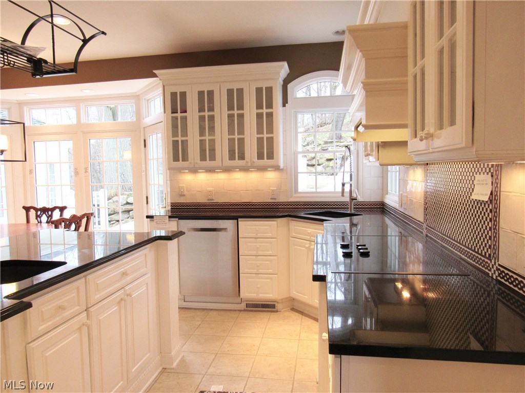 3941 Minor Road Akron, OH 44321 - Photo 9 of 35 Custom cabinets in kitchen with black marble counter tops