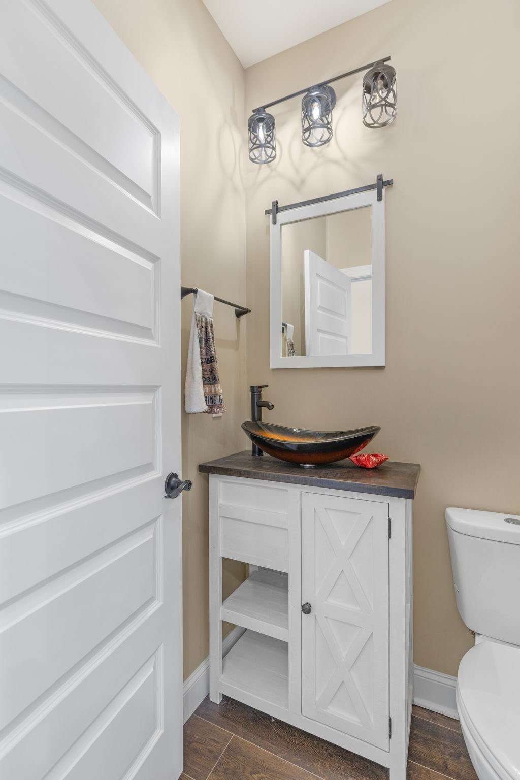 174 Isom Drive Cherokee, AL 35616 - Photo 13 of 50 a bathroom with a toilet a sink and mirror