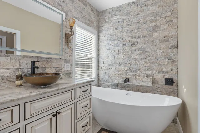 a bathroom with a bathtub and sink