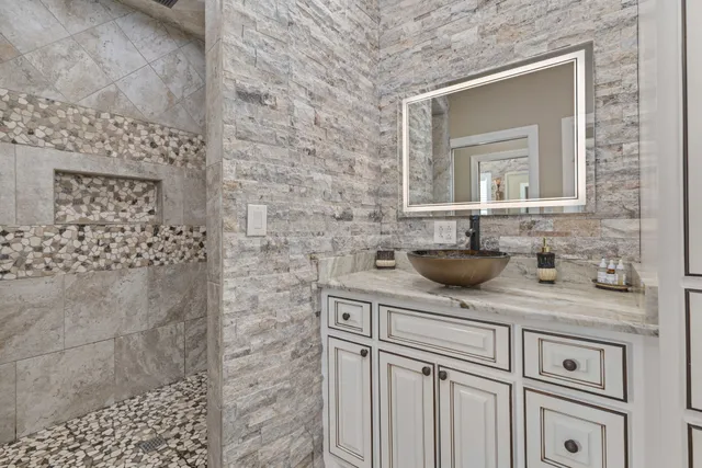 a bedroom with a bed window and a flat screen tv