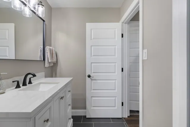 a bedroom with a bed and a dressers