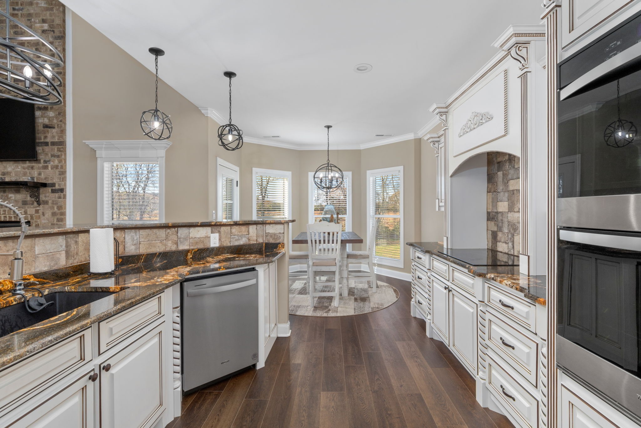 174 Isom Drive Cherokee, AL 35616 - Photo 5 of 50 a large kitchen with a lot of counter space and wooden floor