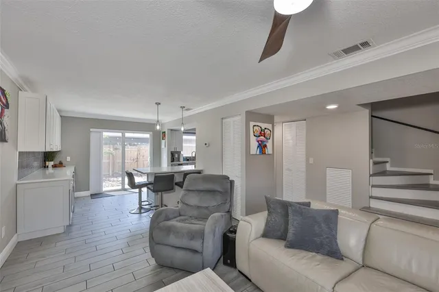 a kitchen with stainless steel appliances kitchen island granite countertop a sink and cabinets