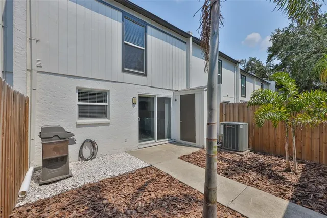 a house view with a backyard space