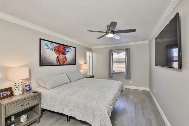 a living room with furniture and a painting on the wall