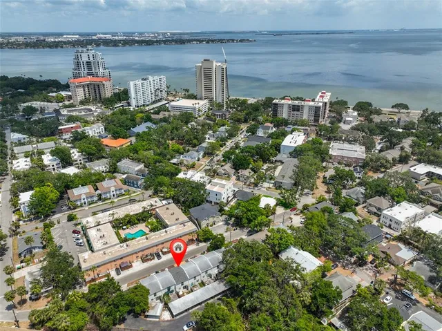 an aerial view of residential building and lake