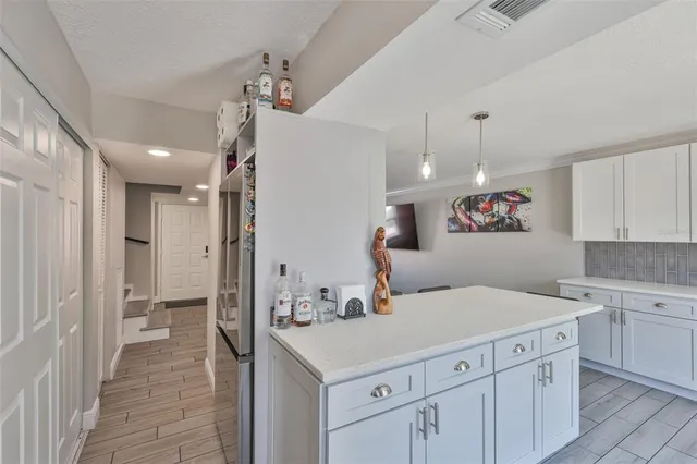 a view of a kitchen with a sink dishwasher a refrigerator and a stove