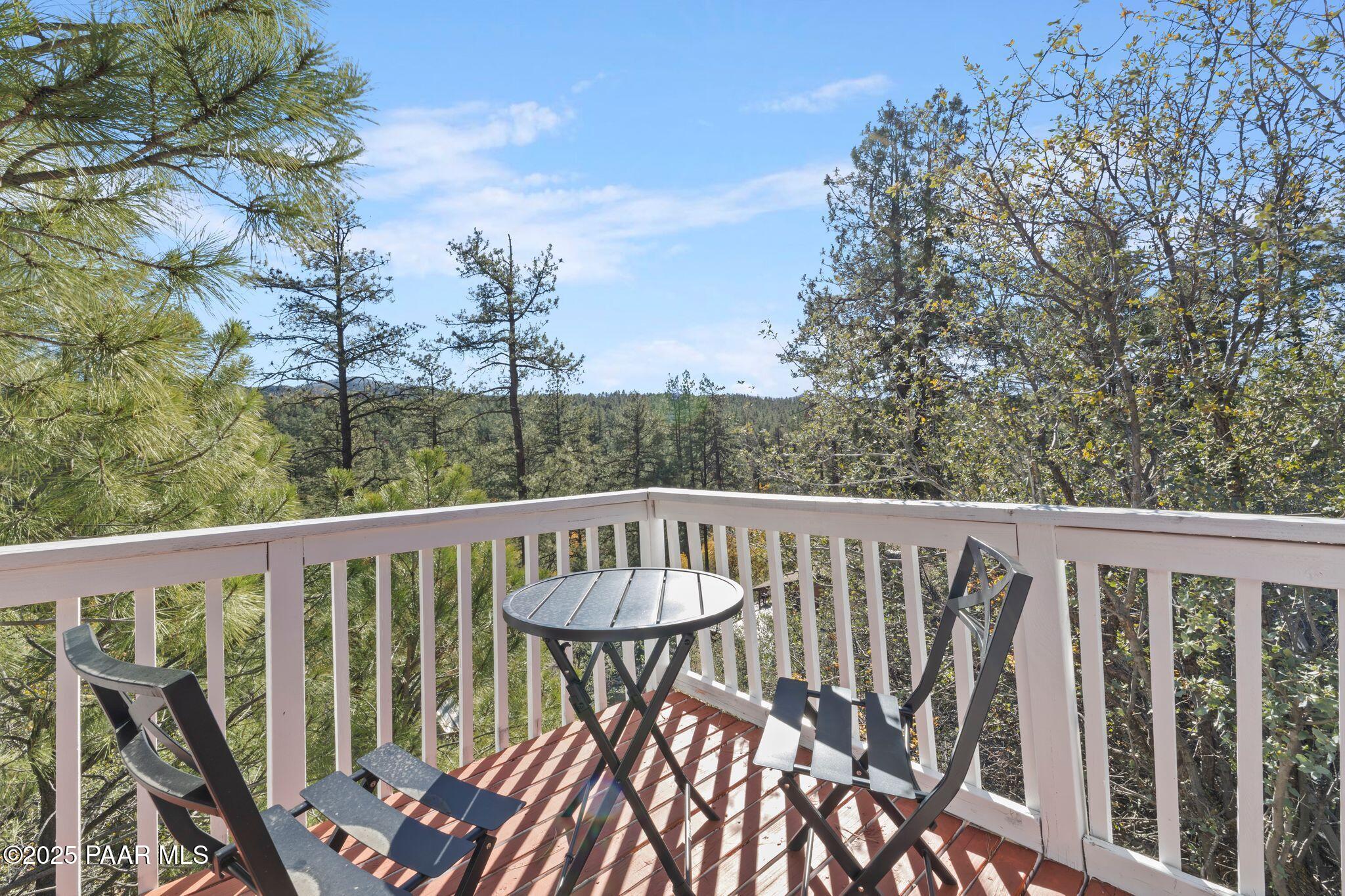 1420 White Spar Road Prescott, AZ 86303 - Photo 21 of 24 a view of a balcony with wooden floor and fence