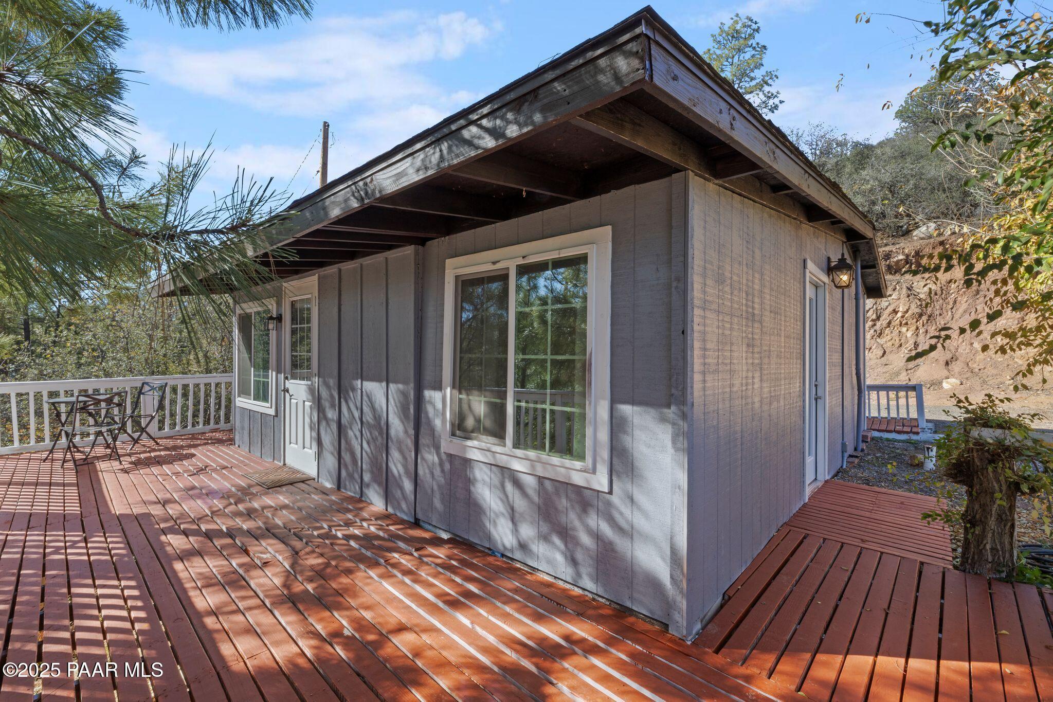 1420 White Spar Road Prescott, AZ 86303 - Photo 22 of 24 a view of a house with a wooden deck