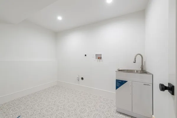 a view of a hallway with wooden floor and closet