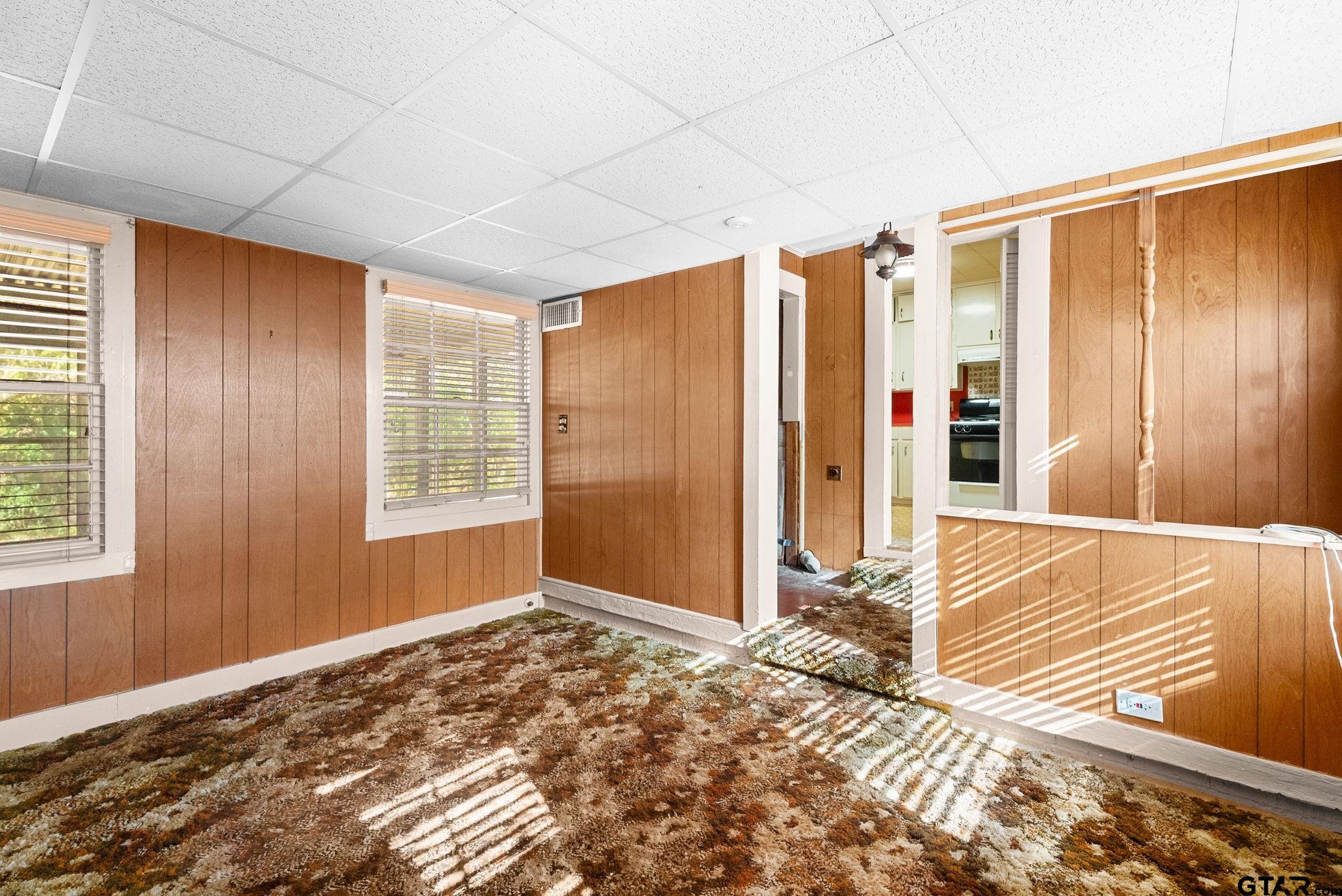 3819 Old Chandler Road Tyler, TX 75702 - Photo 11 of 30 a view of a bedroom with wooden floor and a window