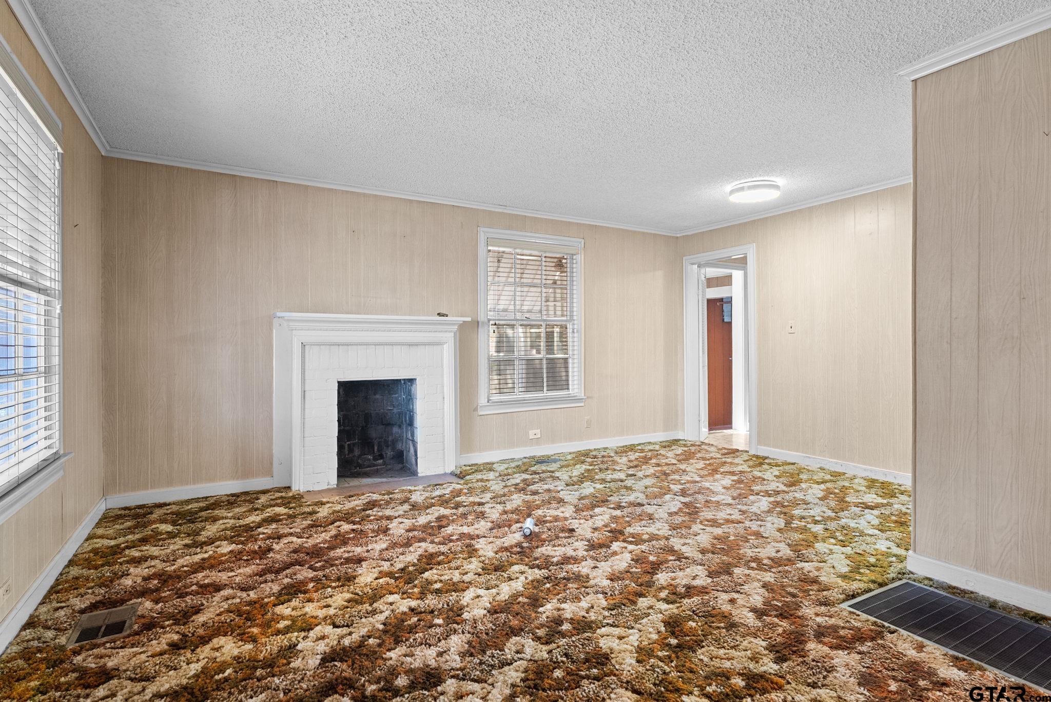 3819 Old Chandler Road Tyler, TX 75702 - Photo 16 of 30 a bedroom with a bed and a window