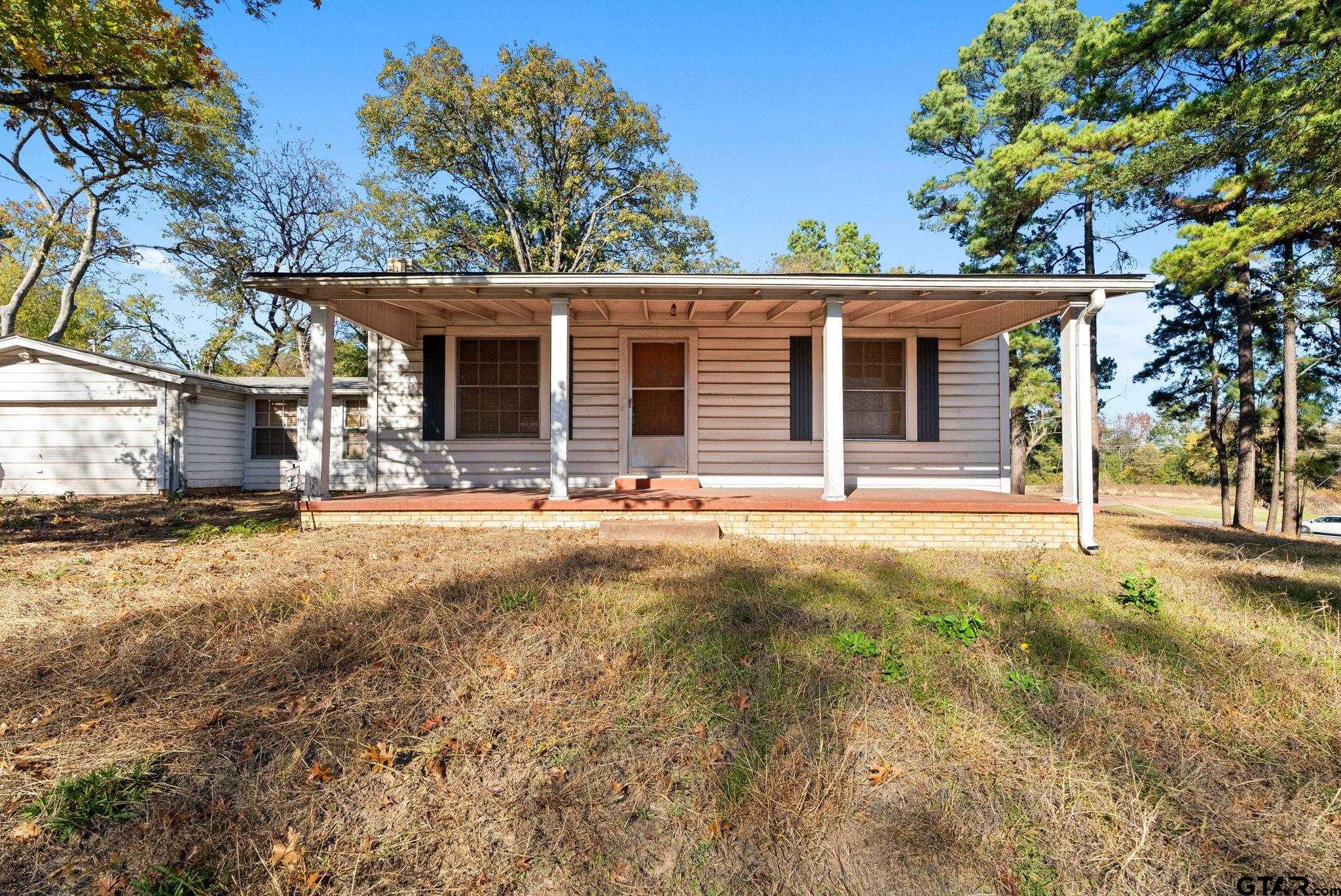 3819 Old Chandler Road Tyler, TX 75702 - Photo 2 of 30 front view of a house with a yard