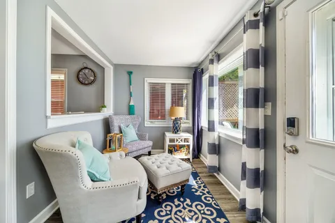 a living room with furniture and a window