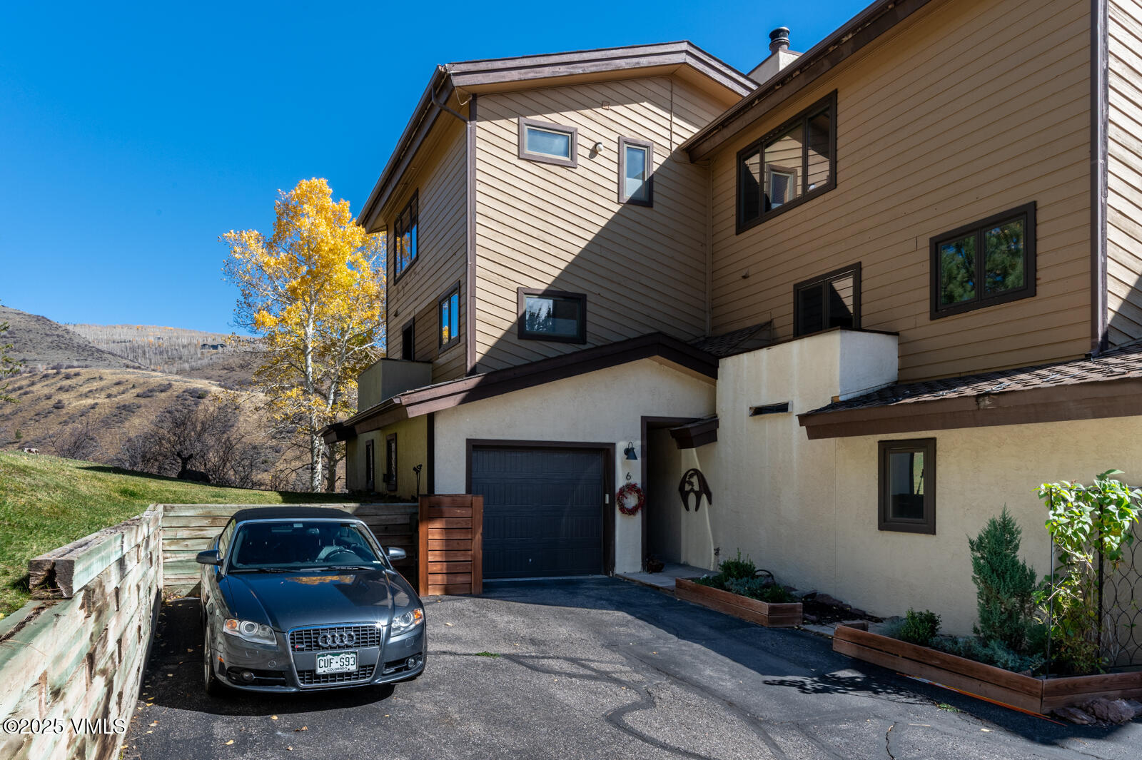 3016 Wildridge Road, Unit 6 Avon, CO 81620 - Photo 33 of 38 a car parked in front of a house