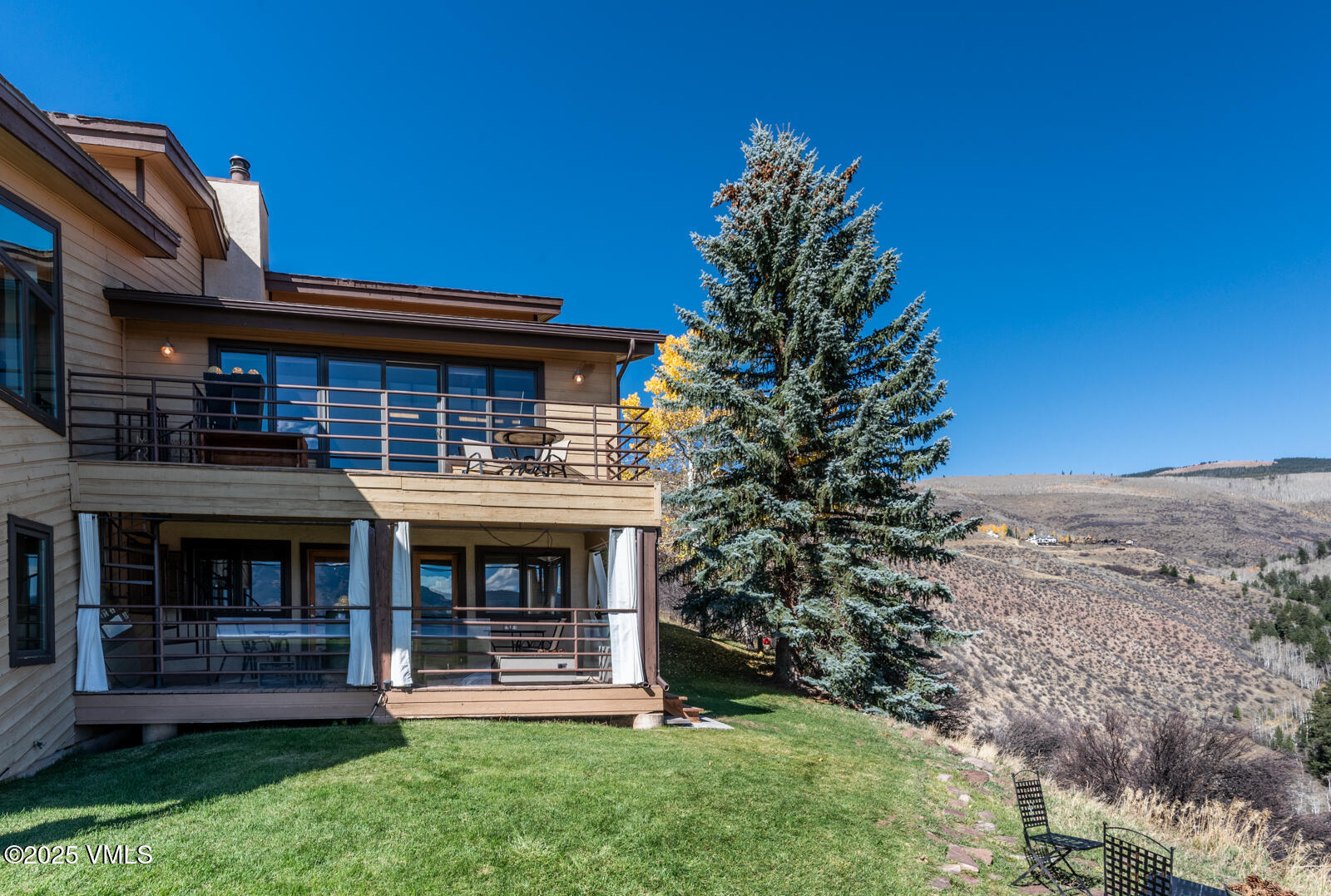 3016 Wildridge Road, Unit 6 Avon, CO 81620 - Photo 34 of 38 a front view of a house with a garden