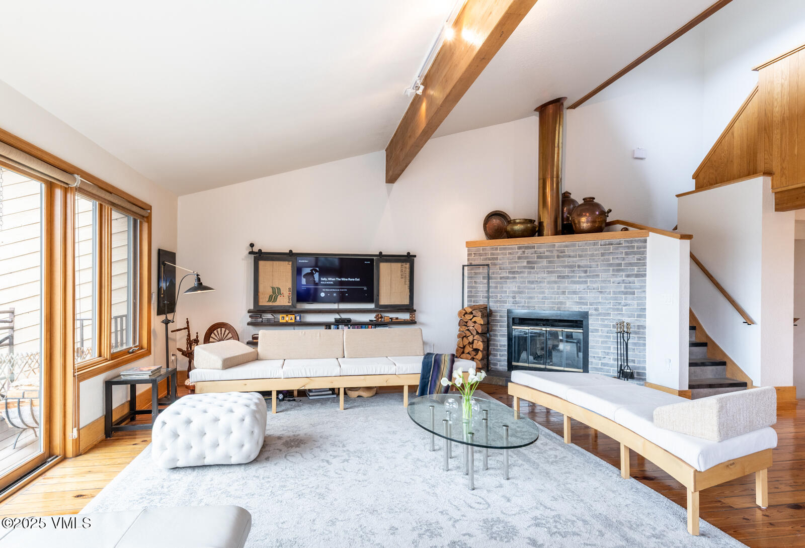 3016 Wildridge Road, Unit 6 Avon, CO 81620 - Photo 5 of 38 a living room with furniture fireplace and flat screen tv