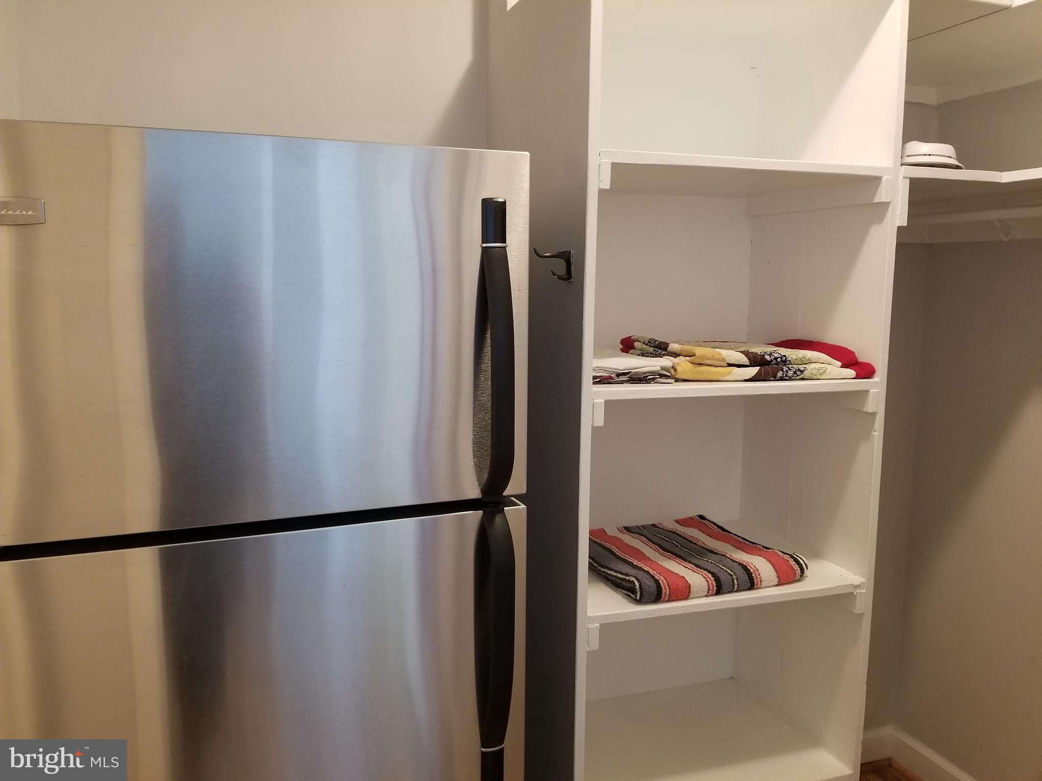 1021 Arlington Boulevard, Unit 414 Arlington, VA 22209 - Photo 12 of 31 a view of a refrigerator in kitchen