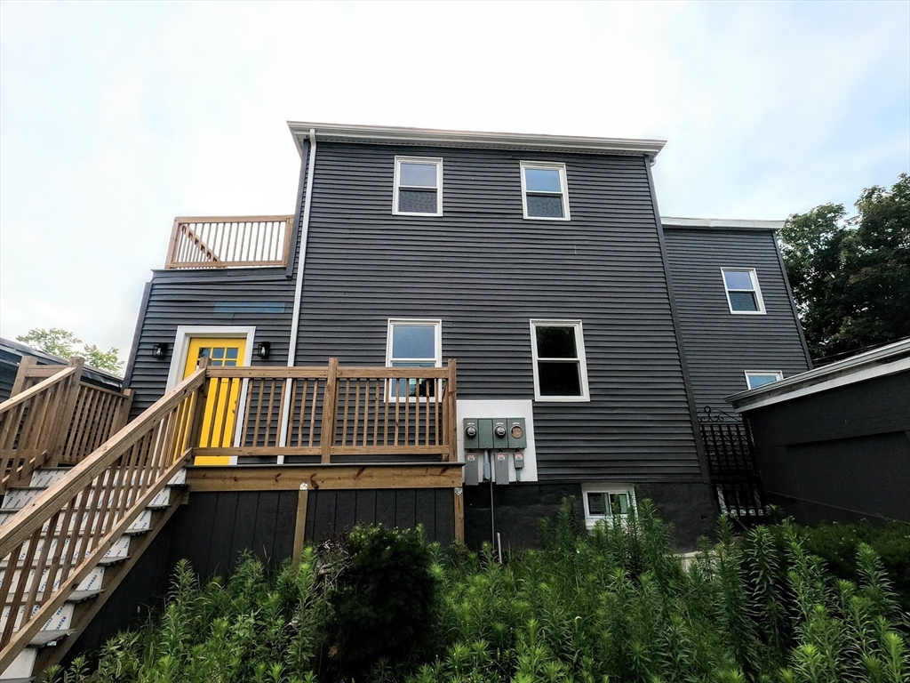 2 Sunnyside Street, Unit 2 Boston, MA 02130 - Photo 1 of 41 a view of a house with wooden fence