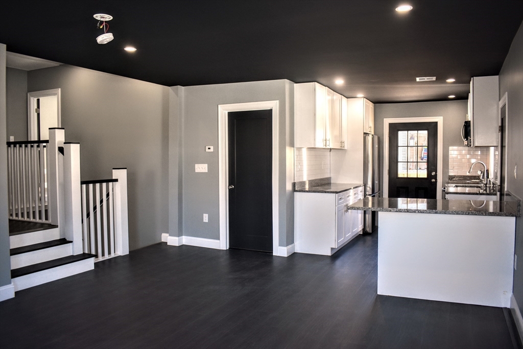 2 Sunnyside Street, Unit 2 Boston, MA 02130 - Photo 15 of 41 a view of a big room with wooden floor windows and a living room