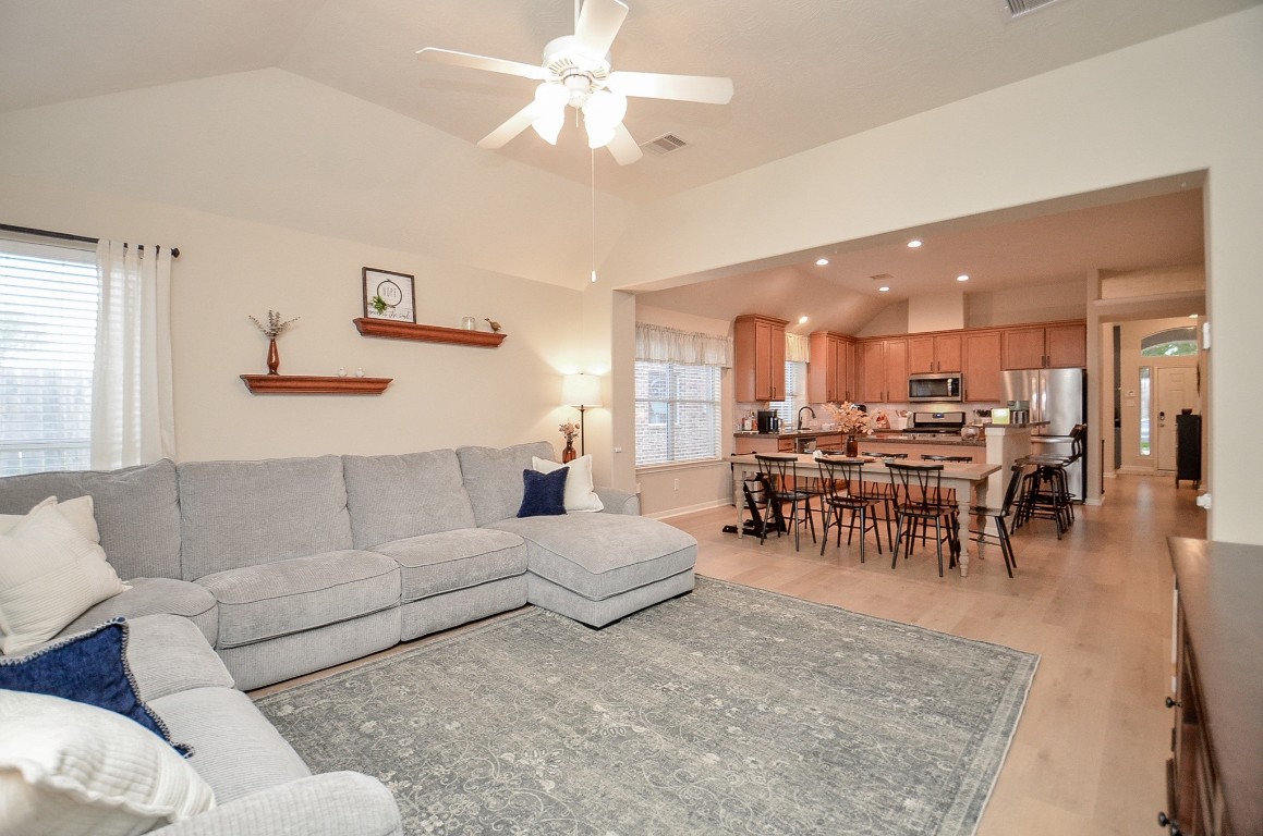 9222 Sorrell Hollow Lane Rosenberg, TX 77469 - Photo 24 of 46 Open-concept living space seamlessly flows into the dining area and kitchen, creating an ideal layout for gatherings and everyday living.