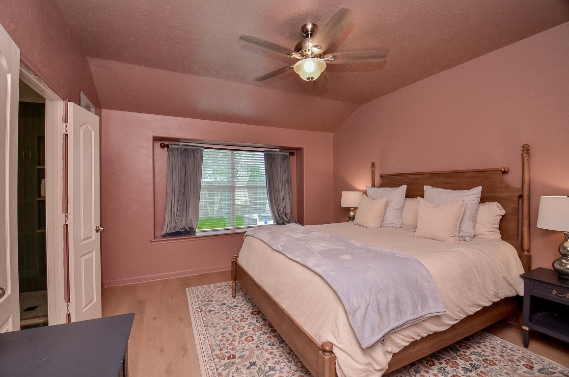 9222 Sorrell Hollow Lane Rosenberg, TX 77469 - Photo 29 of 46 Spacious primary bedroom with abundant natural light and direct access to a private ensuite bath for added comfort and convenience.